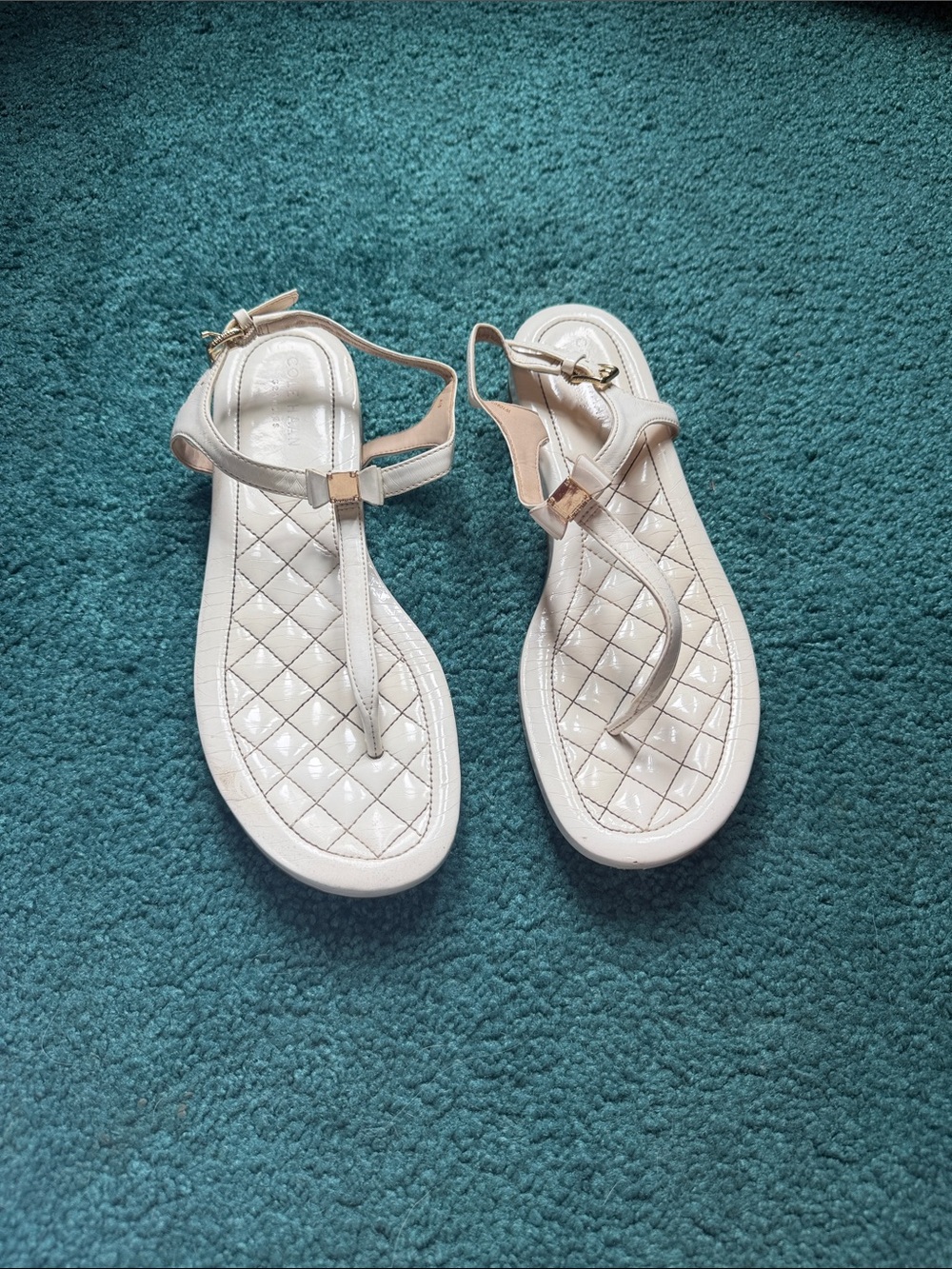 Cole Haan Women’s Quilted T‑Strap Sandals in Light Beige with Gold Accents